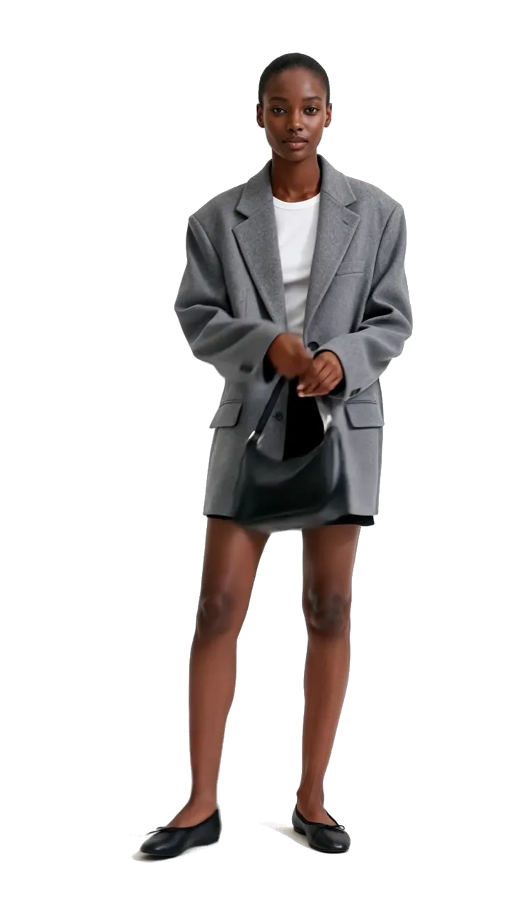 Stockholm style women's outfit: oversized grey blazer, white T-shirt, black mini skirt, ballet flats and a black shoulder bag